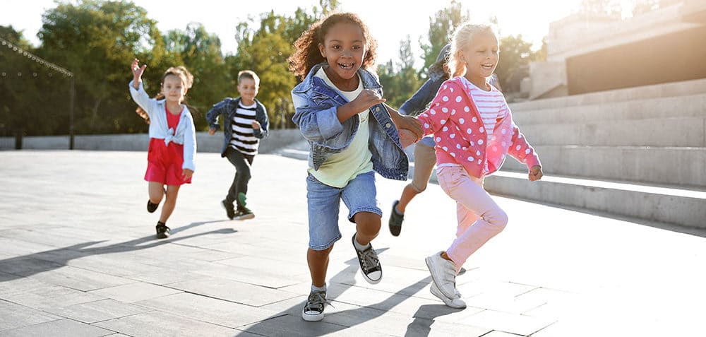 Group of running children outdoors